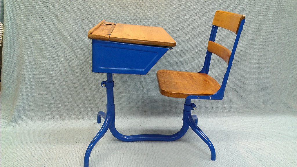 Restored student desk with blue spray paint finish