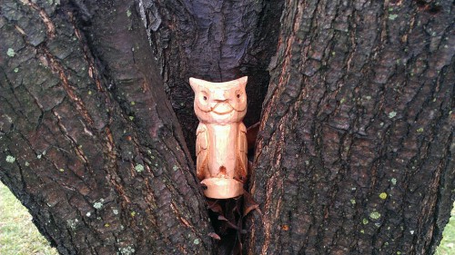 Carved basswood owl guarding the yard