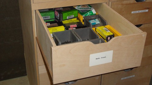 Storage drawer containing finishing nails