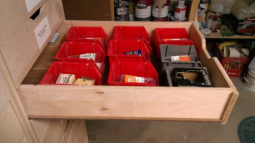 Storage drawer containing several different sizes of wood screws