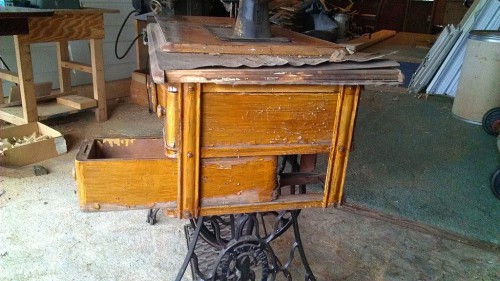 Blistering of old finish on sewing machine cabinet
