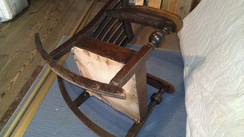 Side view of chair showing beat-up rockers