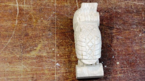 Left side of carved owl