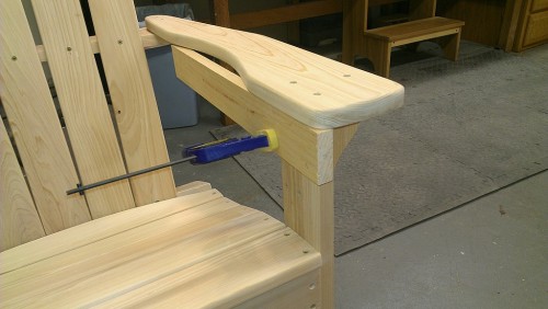 Scrap piece of wood used to align front and inner side of chair arms