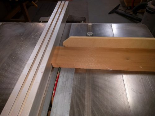 First shoulder kerf is cut using the fence as a stop.