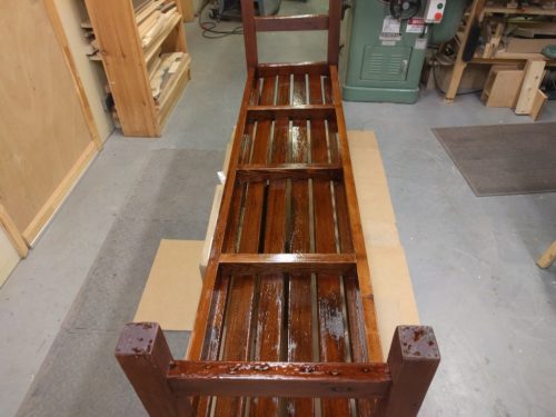 Penetrating epoxy applied to underside of redwood bench
