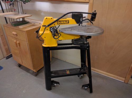 Retractable casters mounted to Dewalt scroll saw stand
